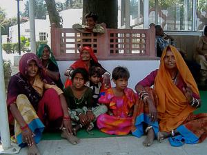 An Indian family, members of a lower caste due to their status as ethnic minorities, wait for a train. An Indian family, members of a lower caste due to their status as ethnic minorities, wait for a train.